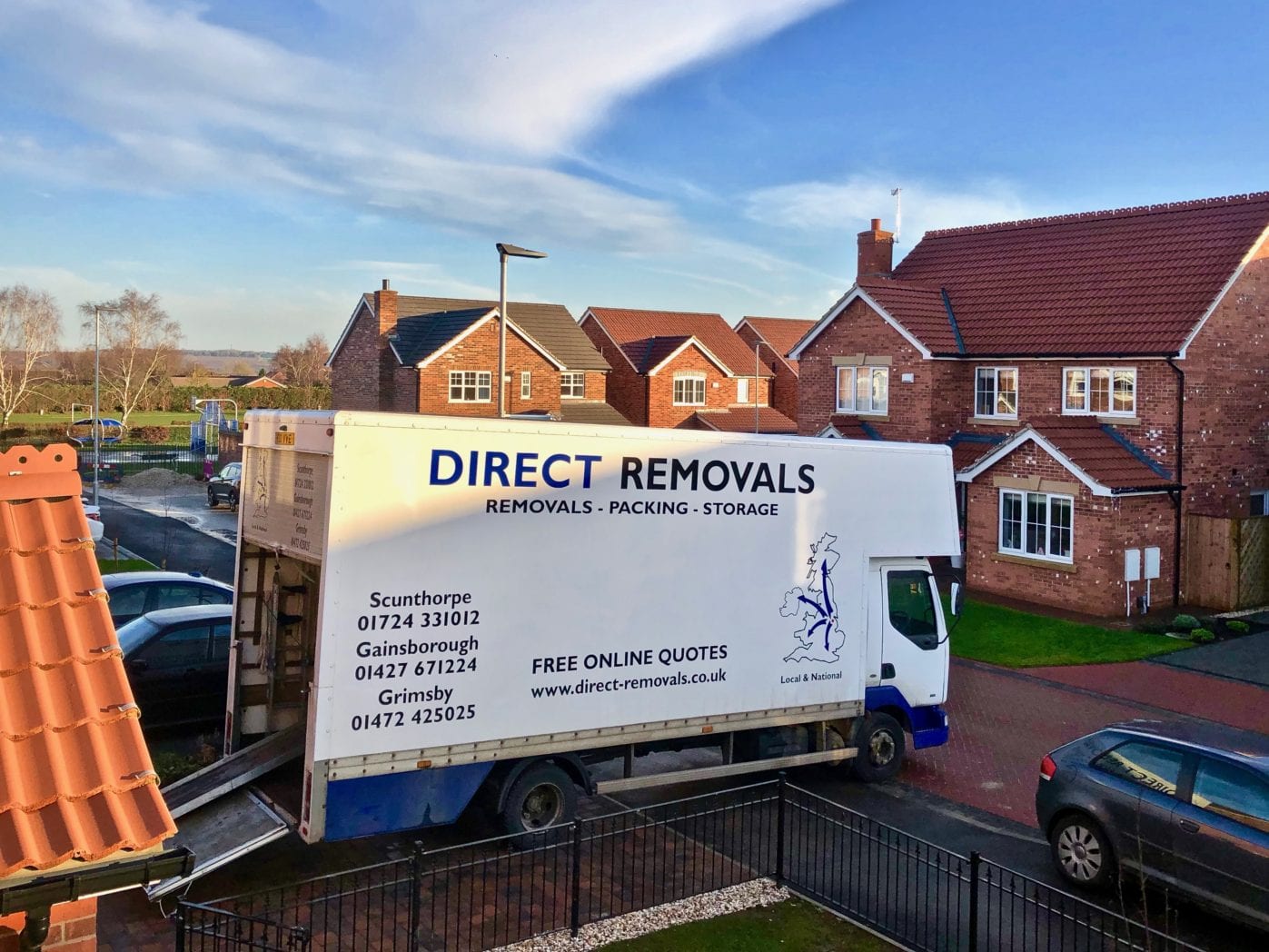 Direct removals unloading furniture at a house